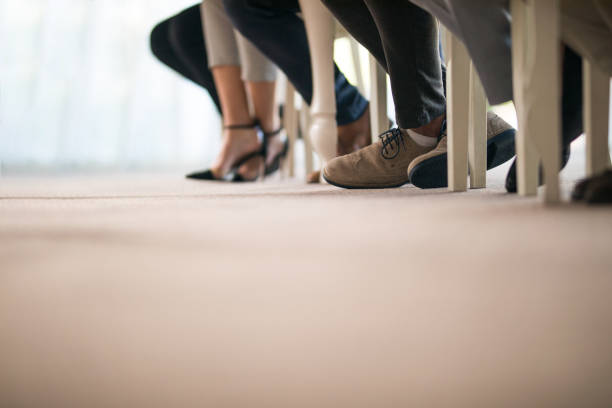 istock Group of unrecognizable business people's legs on a seminar. 955962296