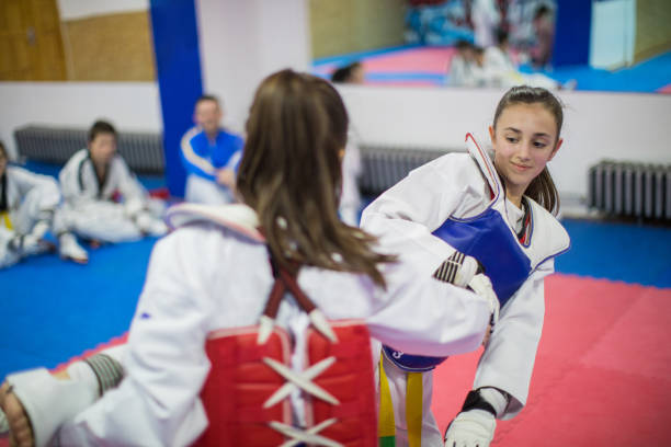 istock Girls having a taekwondo training before the championships 955972062