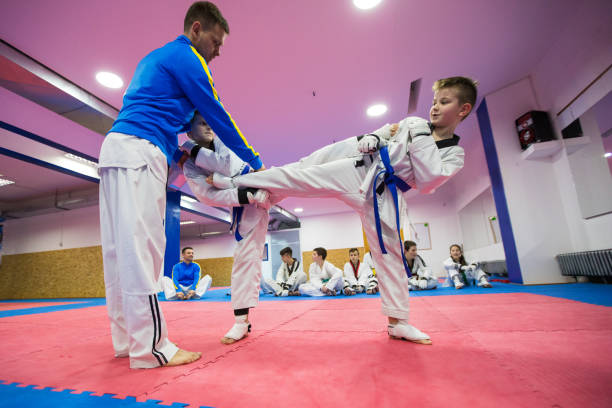 istock Boys having a taekwondo fight 955973288