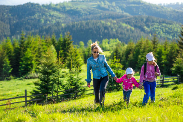 istock Family in green summer meadow 955973546