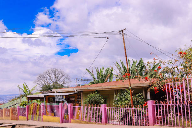 house sky blue pink house Central America stock photo