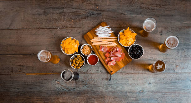 Top view the table in pub Top view the table in the pub with beer and snacks. High angle view of table. pub table top view stock pictures, royalty-free photos & images