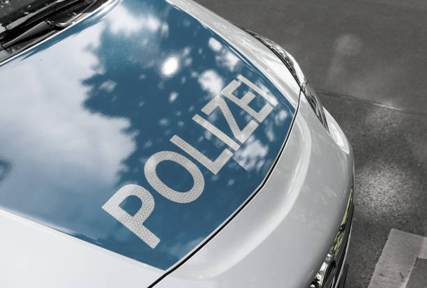 German News Concept: Blue Police Car, Selected Focus BERLIN, GERMANY - MAY 5, 2018: Blue German Police Car, Selected Focus manhunt law enforcement stock pictures, royalty-free photos & images