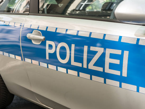 German News Concept: Blue Police Car, Selected Focus BERLIN, GERMANY - MAY 5, 2018: Blue German Police Car, Selected Focus manhunt law enforcement stock pictures, royalty-free photos & images