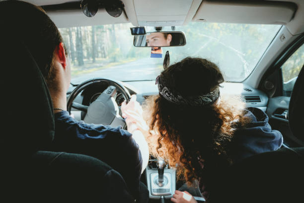 istock Happy couple on the road trip by car 955985582