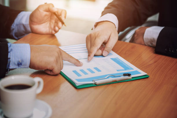 istock Teamwork process, business people working in the office discussing documents and ideas at meeting 955987856