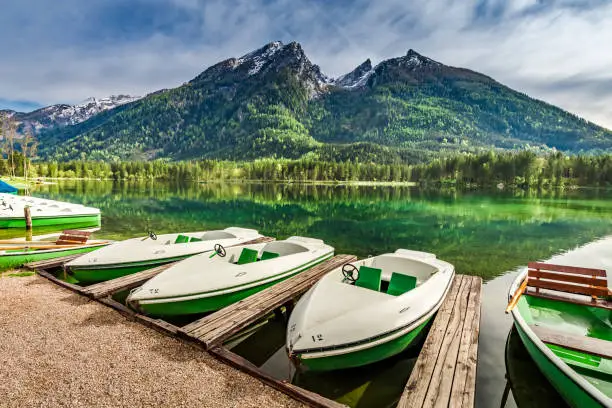 White boats on the lake Hintersee in the Alps