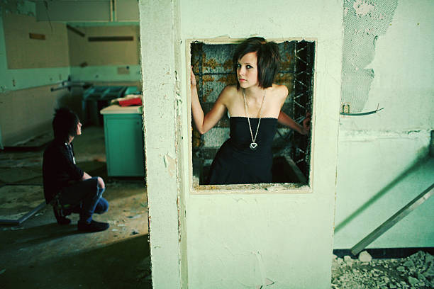 istock boy kneeling girl looking at camera 95599168