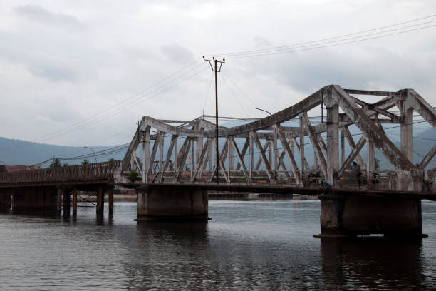 istock Old bridge across river used by pedestrians and bikes 955998752