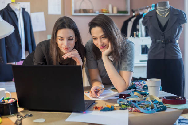 istock Fashion Designers Working In Their Art Studio 955999410