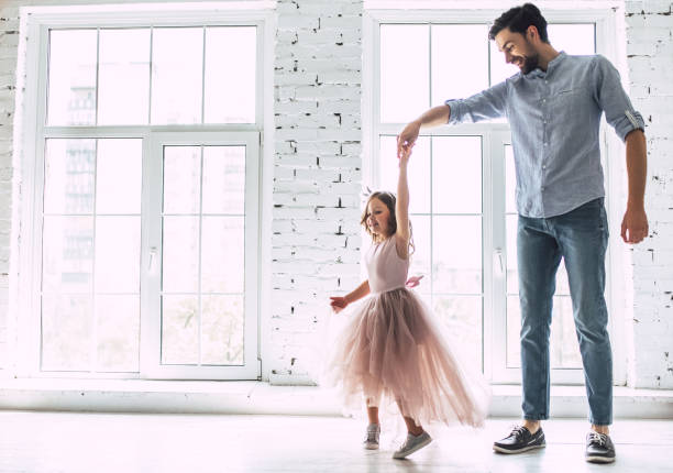 istock Dad with daughter at home 956002726