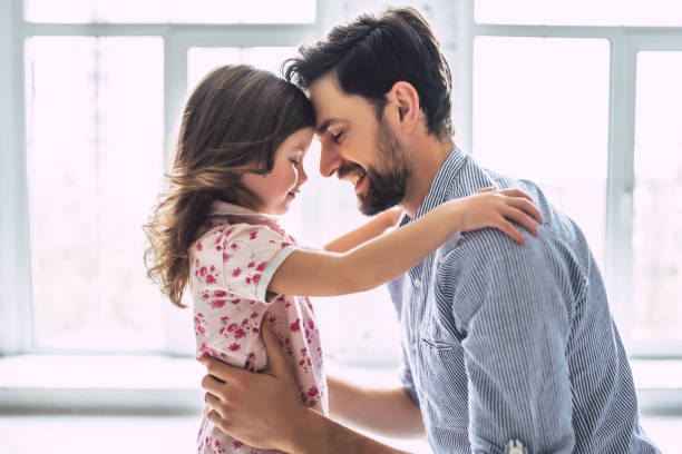 Dad with daughter at home I love you, dad! Handsome young man at home with his little cute girl. Happy Father's Day! fathers day fathers love day stock pictures, royalty-free photos & images