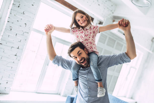 istock Dad with daughter at home 956003506