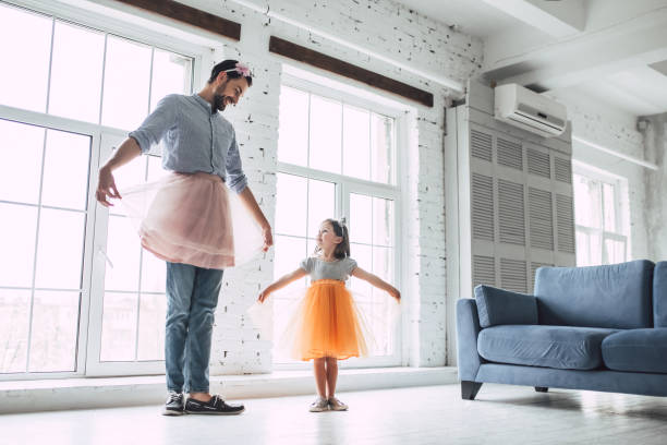 istock Dad with daughter at home 956003564