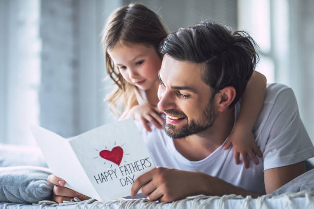 istock Dad with daughter at home 956004540