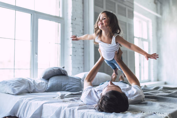 istock Dad with daughter at home 956004662