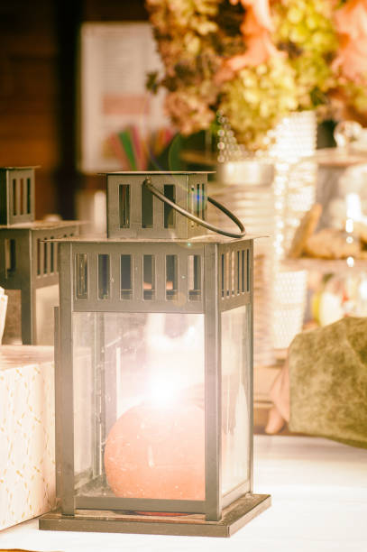 istock lantern with a red round candle close-up 956004836