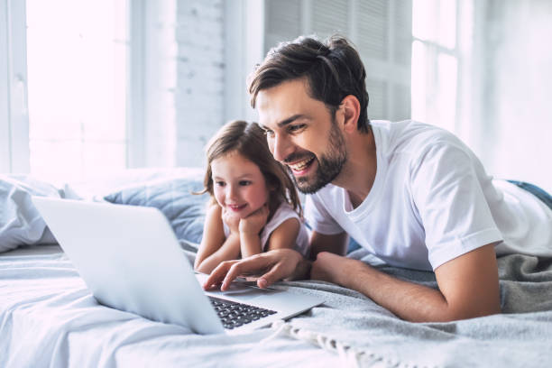 istock Dad with daughter at home 956005058