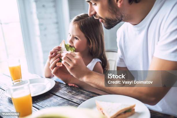 Dad With Daughter At Home Stock Photo - Download Image Now - Eating, Family, Sandwich