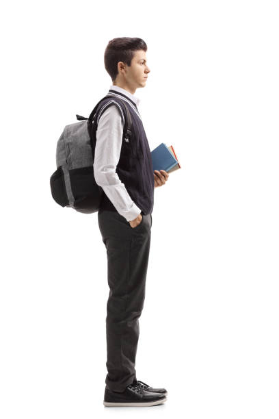 istock Teenage student with a backpack and books waiting in line 956005410