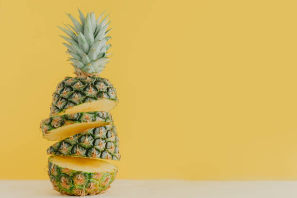 istock Colorful sliced pineapple on pink 956006048