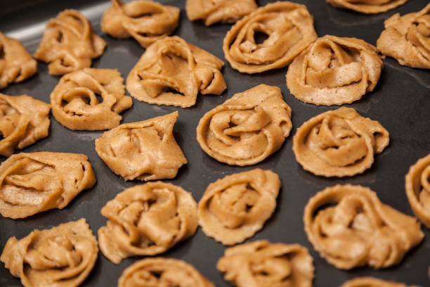 istock Raw Chebakia dough shaped roses on a tray. 956006068