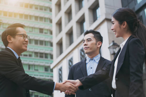istock Businesspeople making handshake agreement. concept cooperation. 956010168
