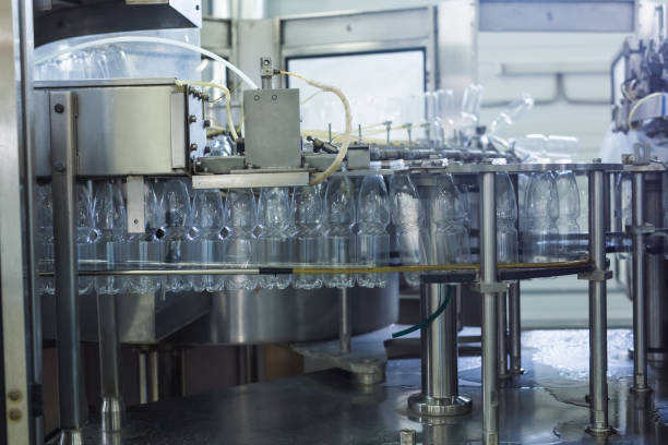 istock Water factory - Water bottling line for processing and bottling pure spring water into small bottles 956014214