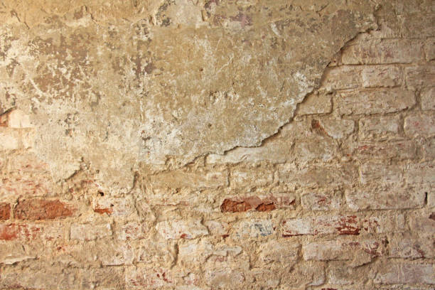istock Red, Terracotta and White Brick Background. Old Wall of Red Bricks and White Brayed and Cracked Old Paint. 956014280