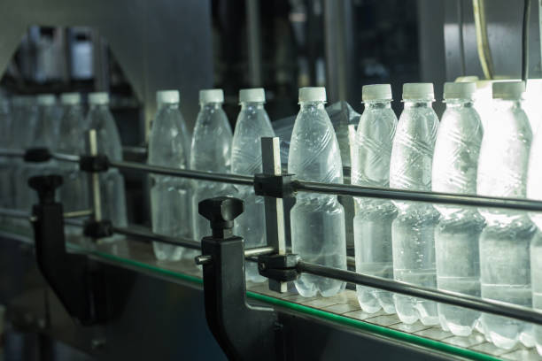 istock Water factory - Water bottling line for processing and bottling pure spring water into small bottles 956014408