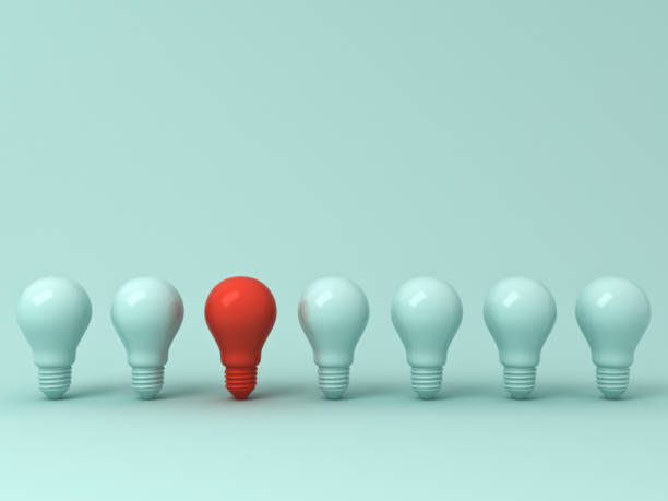 istock Think different concept , One red light bulb standing out from the green incandescent lightbulbs on green pastel color background , leadership and different creative idea concept. 3D rendering 956014508