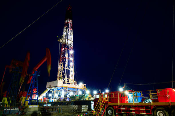 istock Oil drilling rig in the evening 956014616