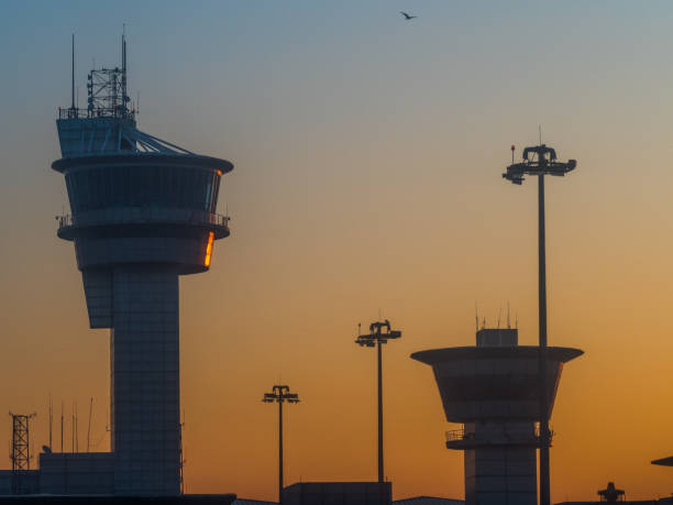istock Airport control towers at sunset 956016888