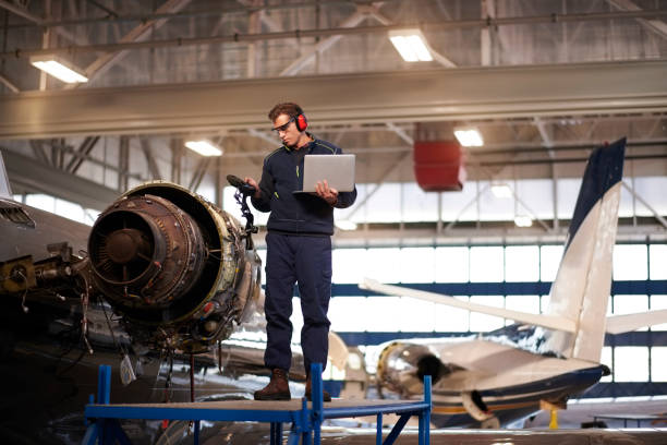 istock Aircraft mechanic in the hangar 956019704
