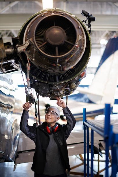 istock Aircraft mechanic in the hangar 956020028