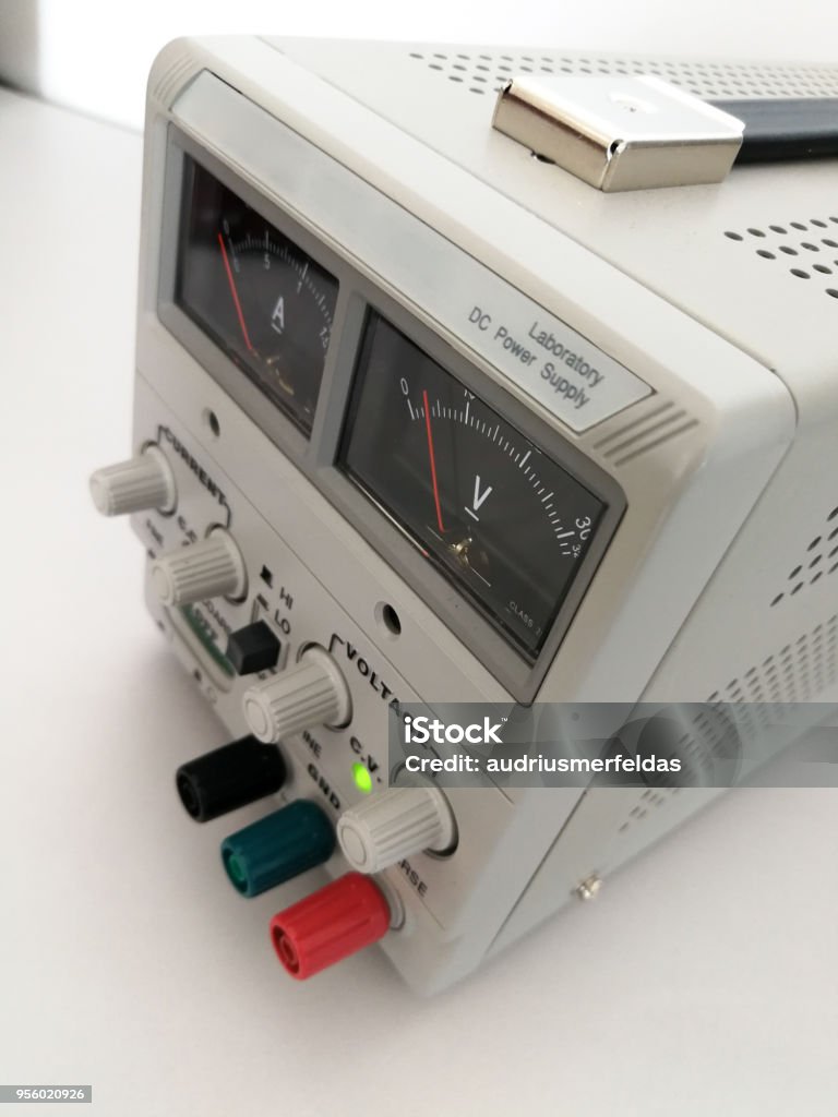 Laboratory adjustable voltage DC power supply for electronics engineering work Precise variable voltage and current power supply used in prototyping and engineering Accuracy Stock Photo