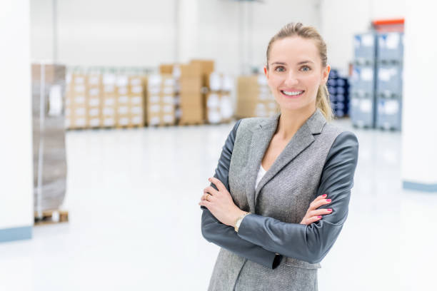 istock Confident business person at warehouse 956025978