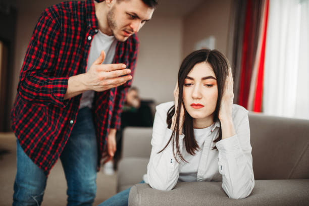 istock Angered husband yells on wife, family quarrel 956030320
