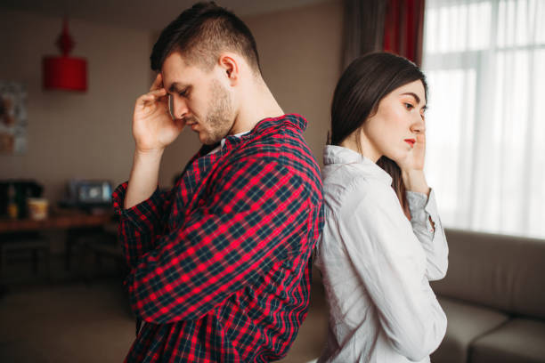 istock Couple sitting back to back on couch, quarrel 956030460