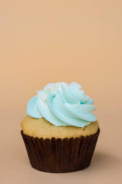 istock sweet cup cake dessert on yellow background and copy space 956031068