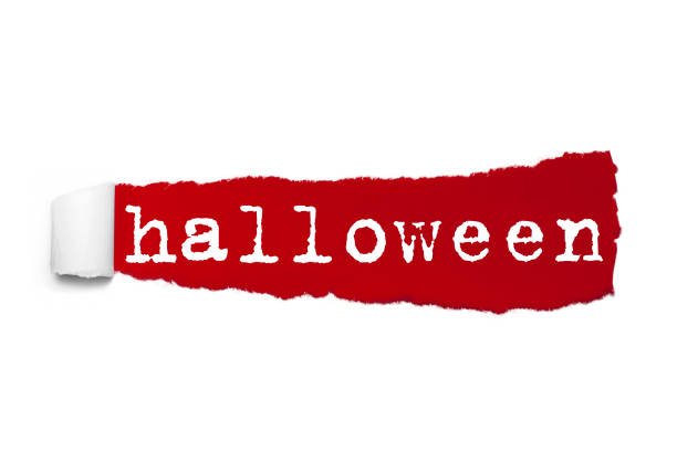 istock Word HALLOWEEN written under the curled piece of Red torn paper. Concept Image 956035520