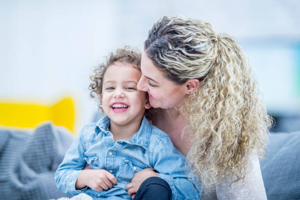 istock Kissing Daughter On The Cheek 956040710