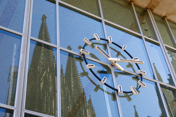 istock Station Clock with reflecting Cologne Cathedral Towers 956041194