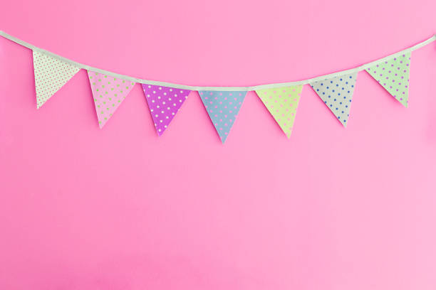 Vintage color fabric party flag on pink wall