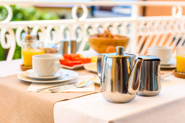 istock Continental morning breakfast table setting with sea view is served. 956044616