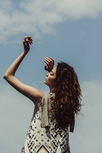 istock young woman enjoying her day under the sunlight 956045364