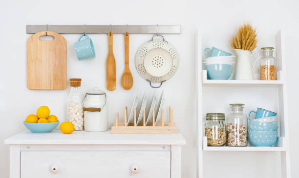 istock Kitchen wall decorated interior with cabinet and shelf with utensils 956045450