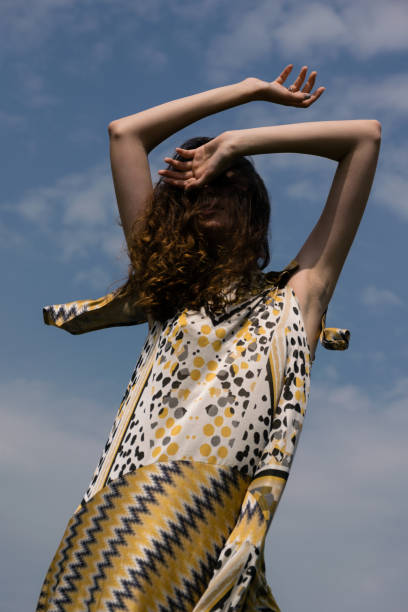 istock young woman enjoying her day under the sunlight 956045634