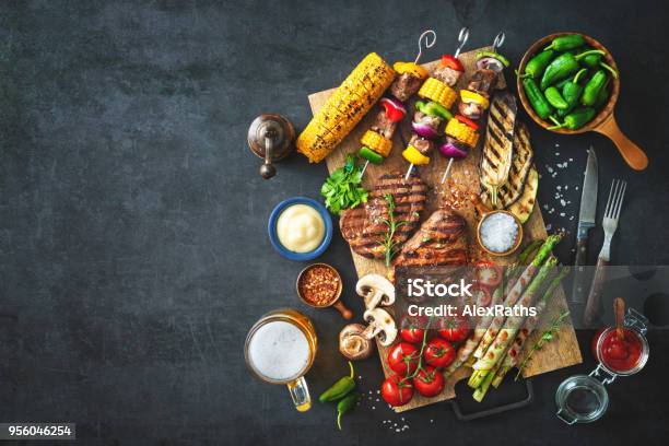 Grilled Meat And Vegetables On Rustic Stone Plate Stock Photo - Download Image Now - Barbecue Grill, Barbecue - Meal, Grilled