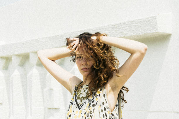 istock young woman enjoying her day under the sunlight 956047564